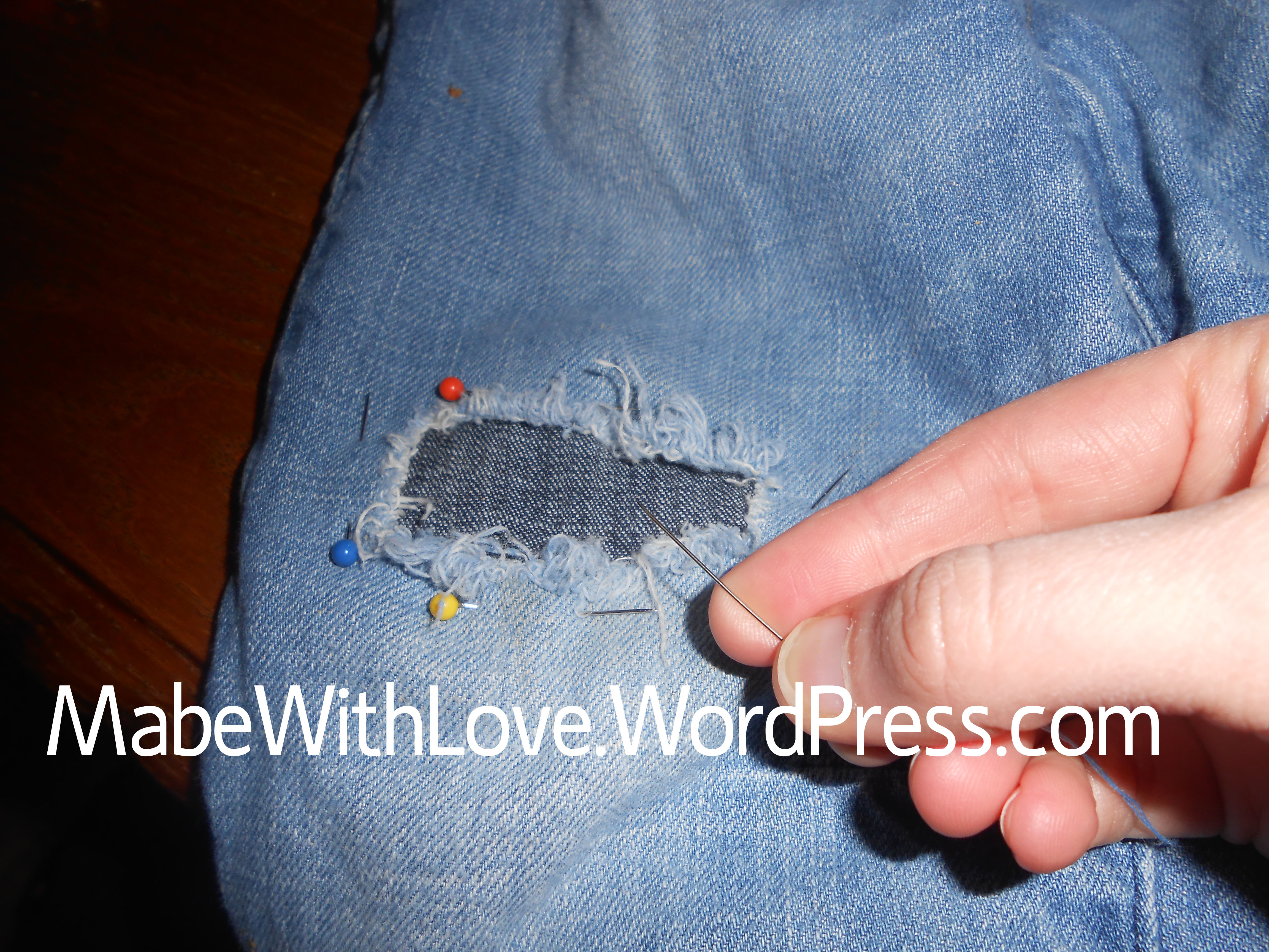 patching jeans by hand